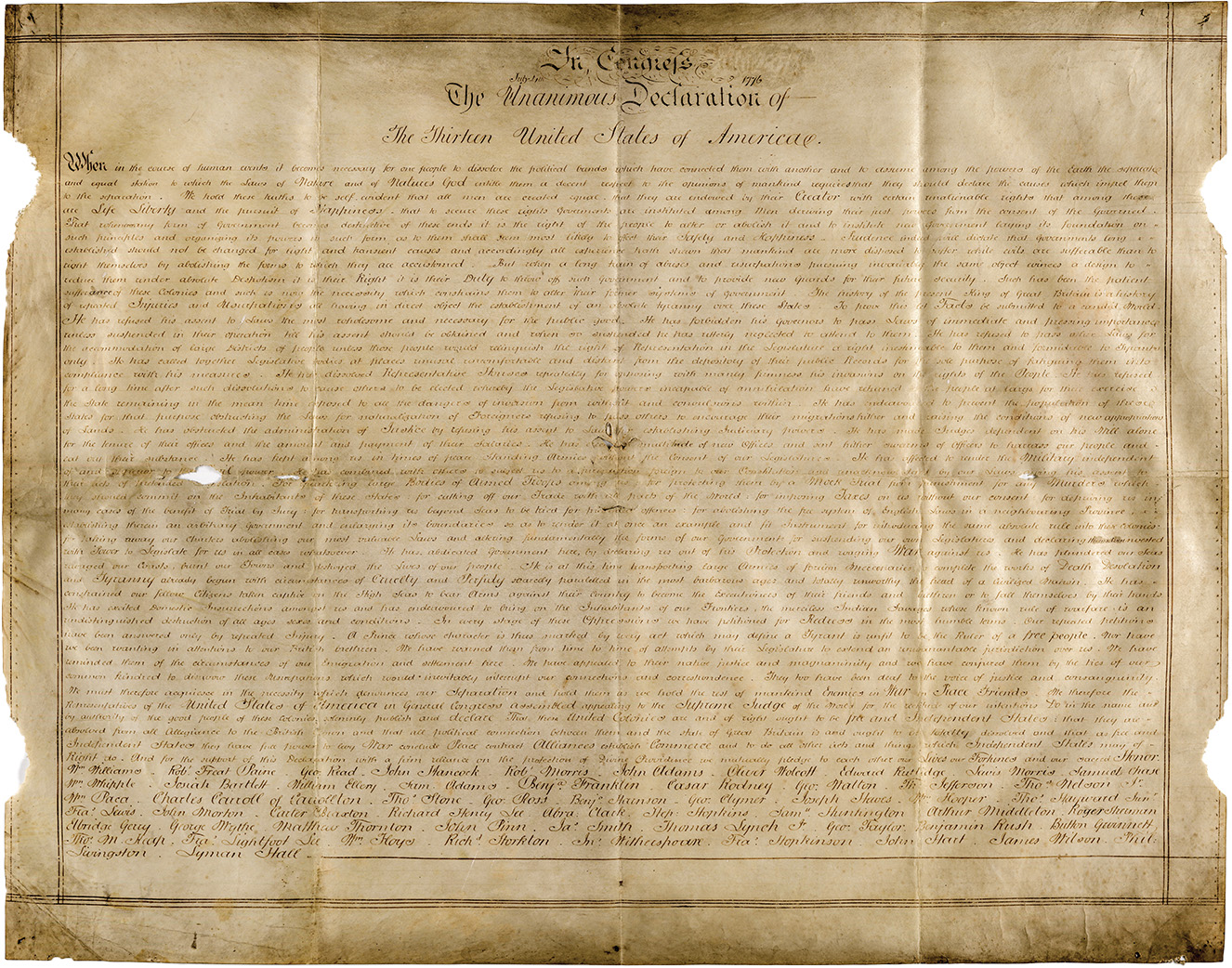 photo of large unfolded handwritten parchment titled The Unanimous Declaration of the Thirteen United States of America
